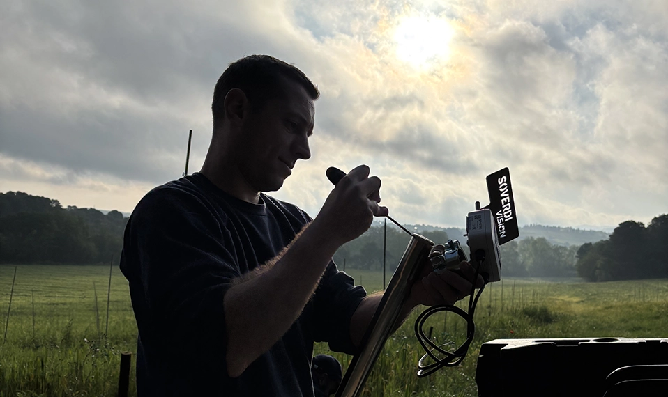 Soverdi technician installing a SPHERAG Atlas IoT device in a regenerative olive farm